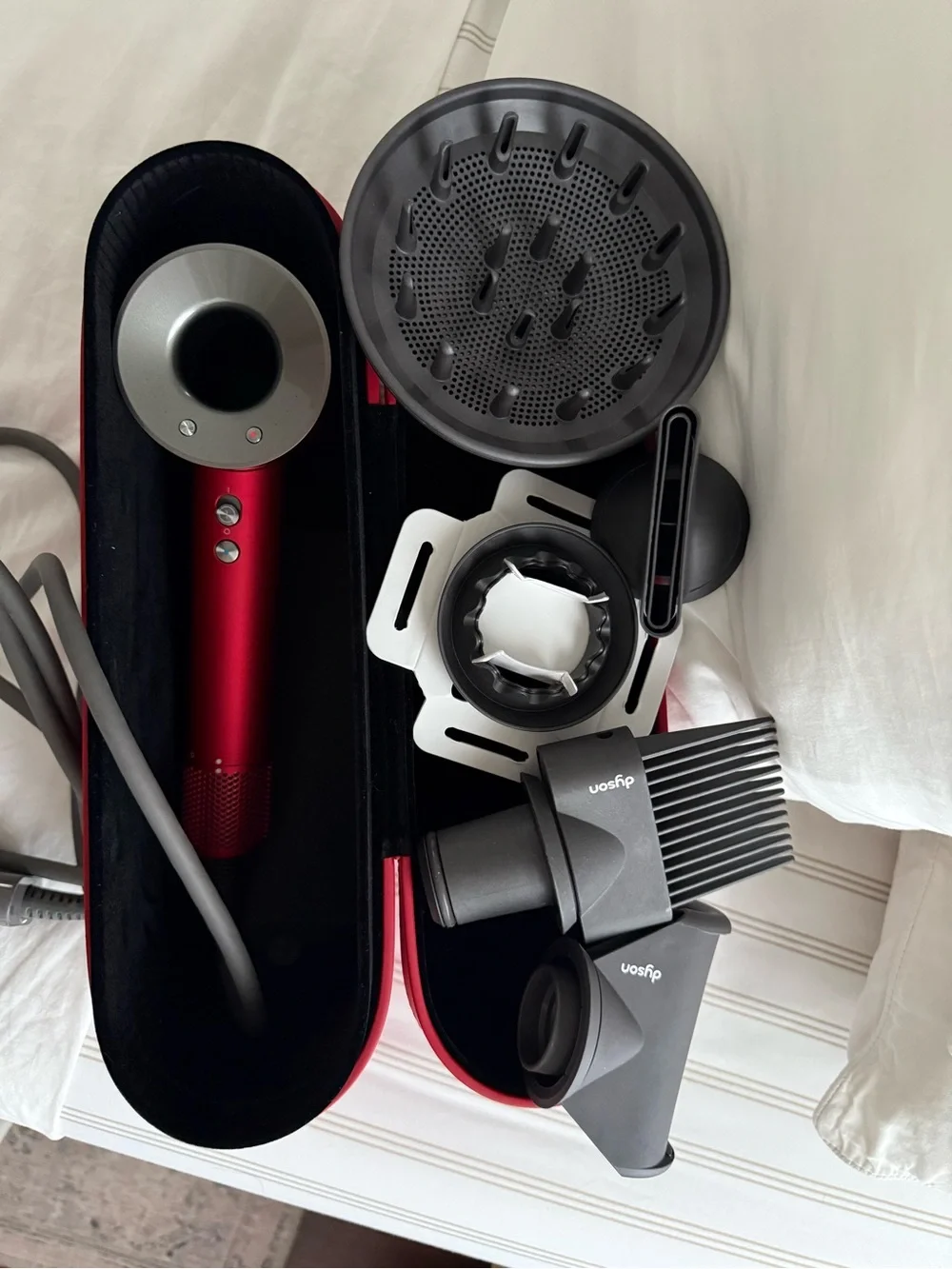 Dyson Hair Dryer with Red and Silver Accessories